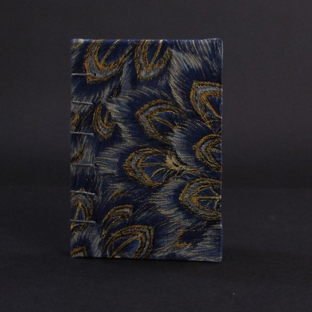 Blue peacock mini coptic bound book cover featuring blue and gold peacock feather