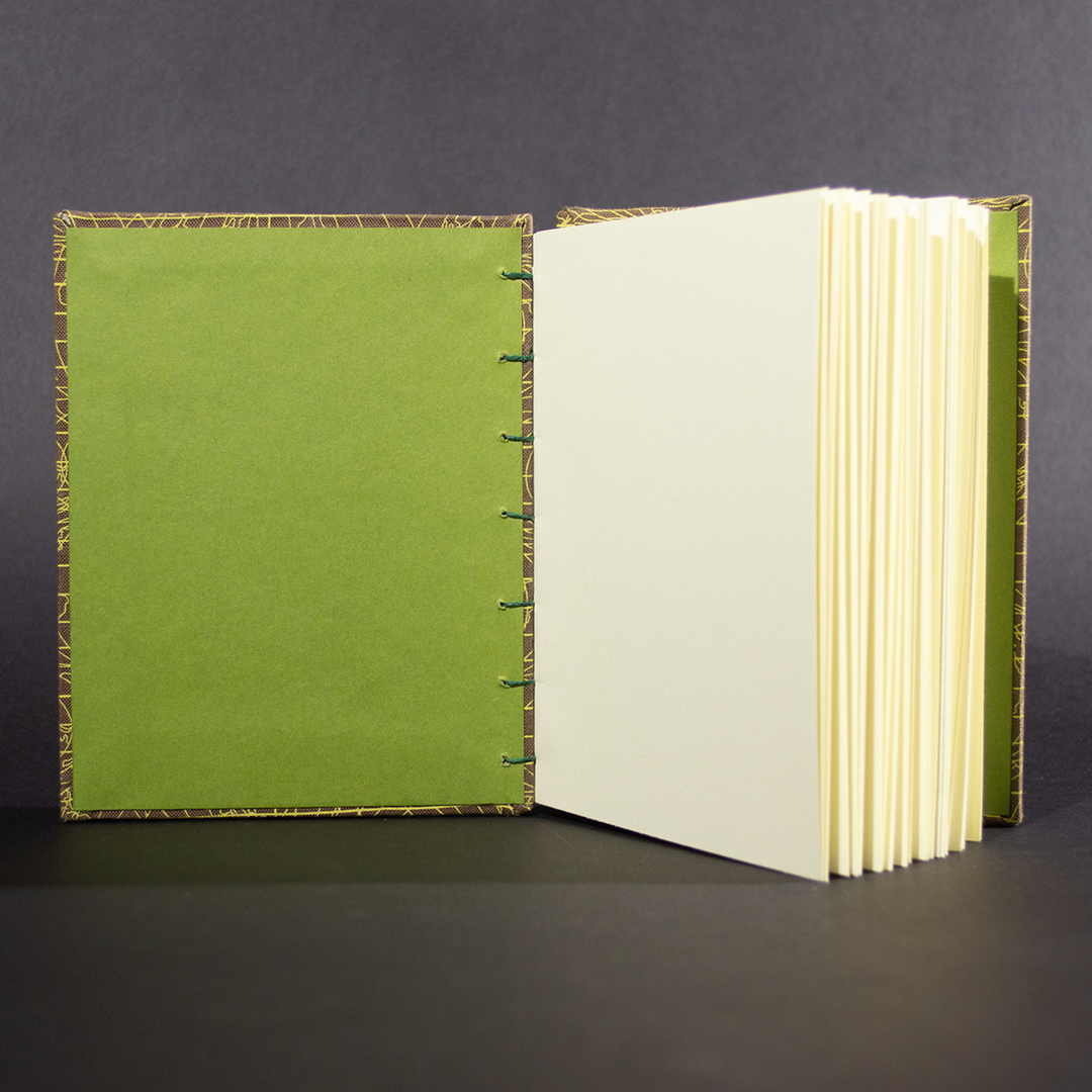 Brown globe Octavio octavo bound journal inside with olive end pages and ivory text pages