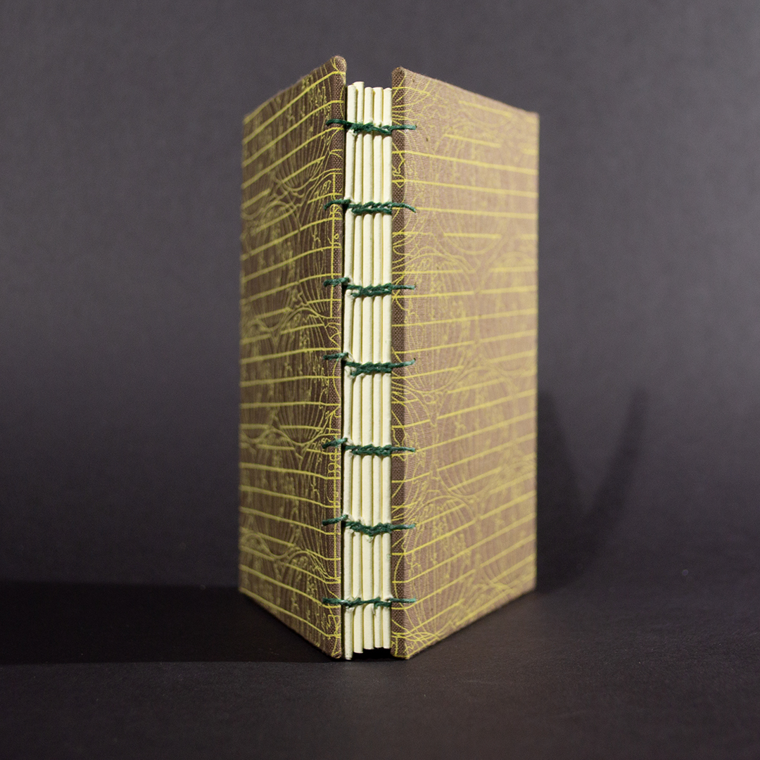 Brown Globe octavo Coptic bound journal spine