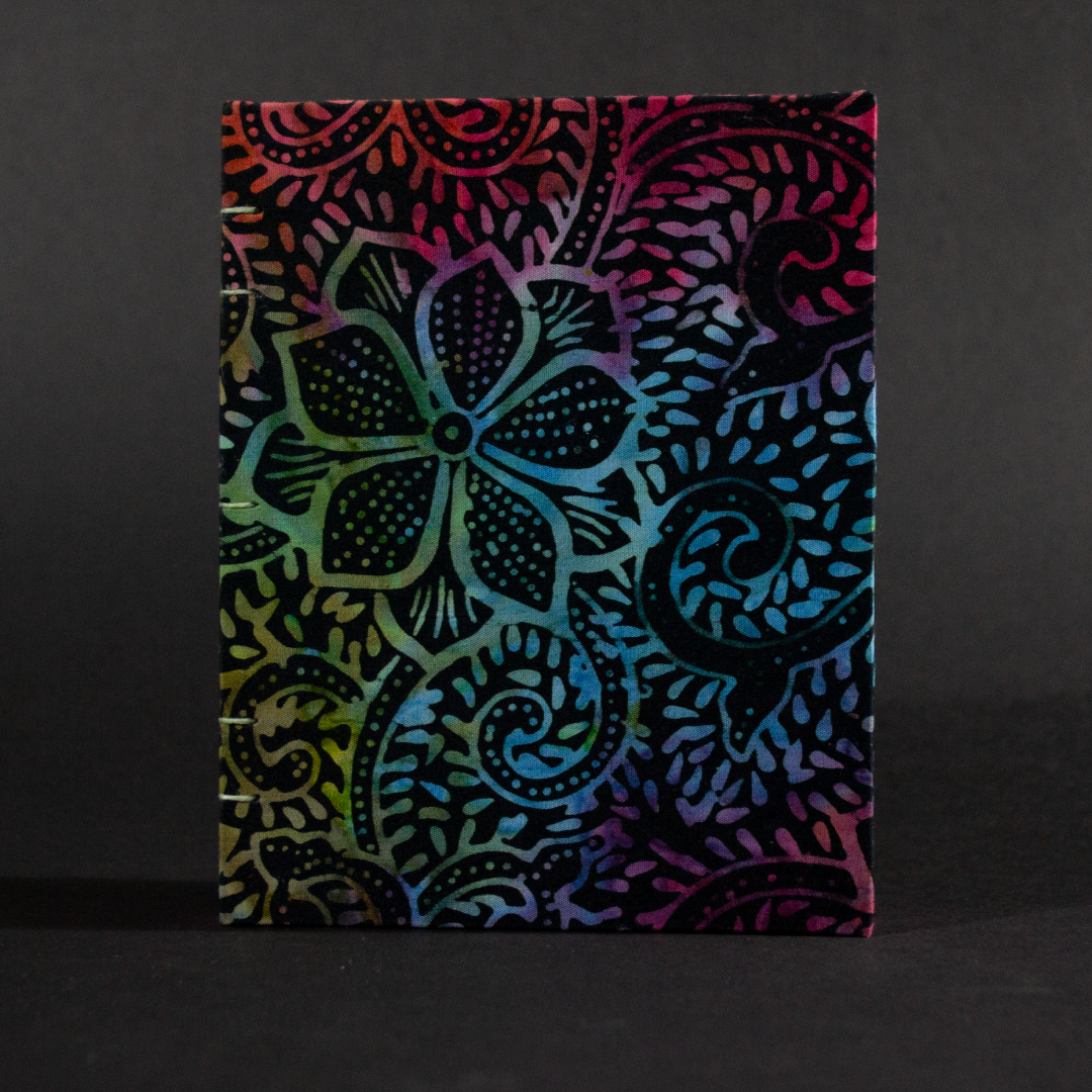 Cover of rainbow batik flowers octavo Coptic book