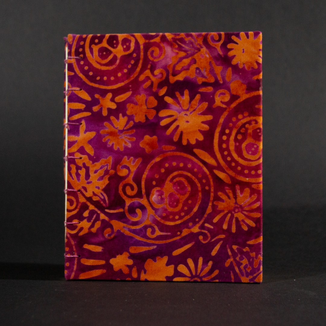 Cover of orange floral batik octavo Coptic book