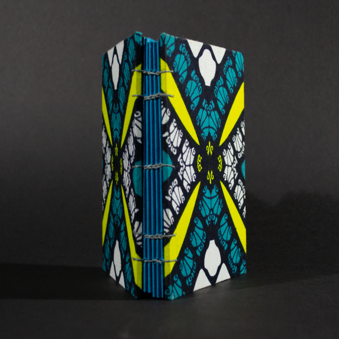 Spine of geometric blue and yellow octavo Coptic book