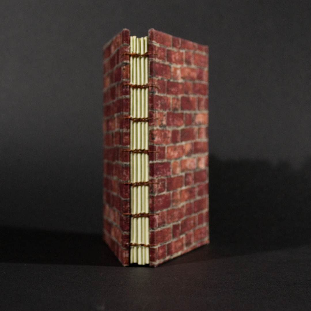 Spine of brick octavo Coptic book