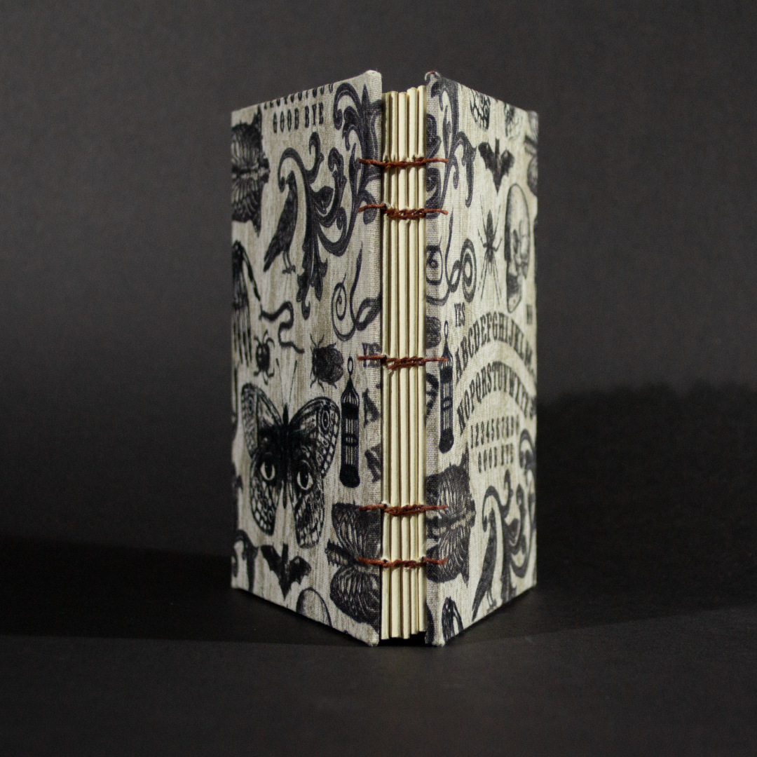 Spine view of ouija octavo Coptic book