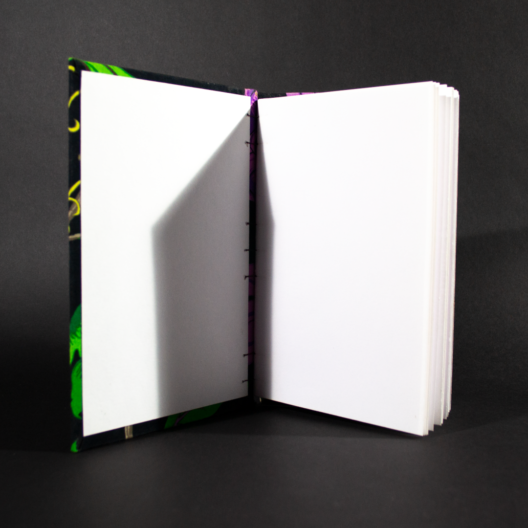 Black floral quarto Coptic bound journal front cover with white end and inside pages.