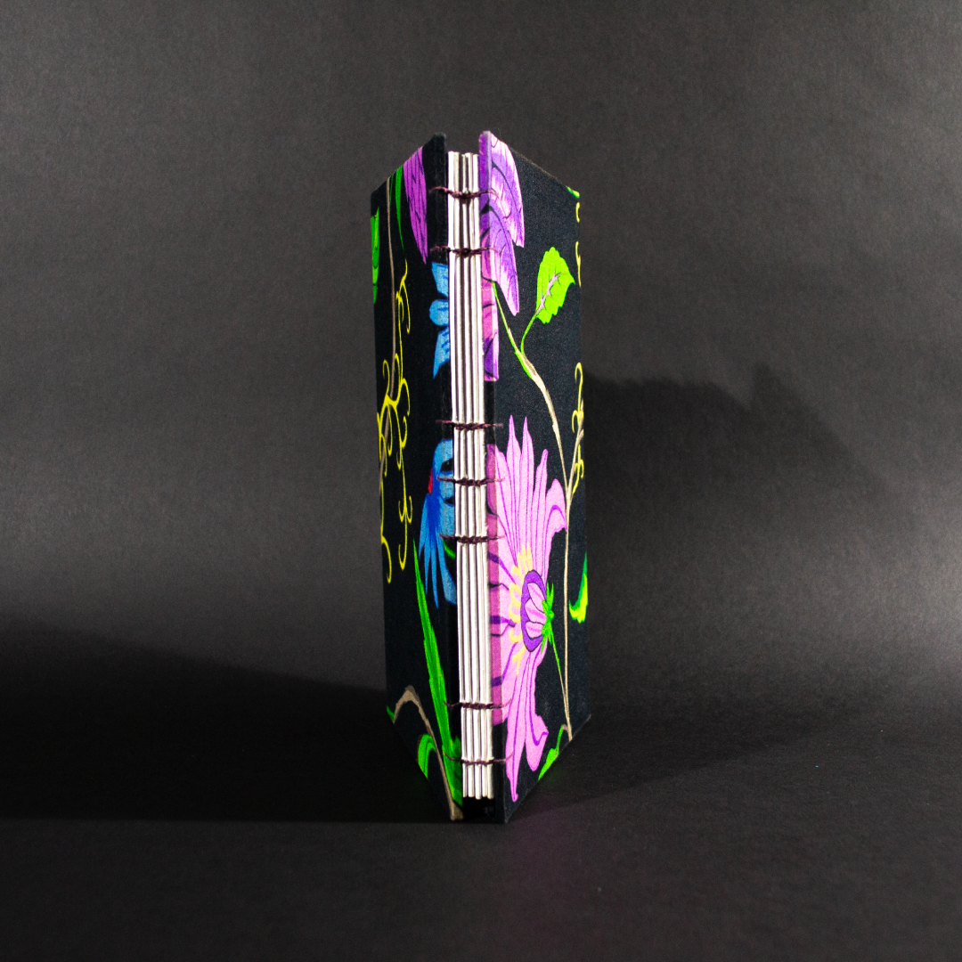 Black floral quarto Coptic bound journal view of spine