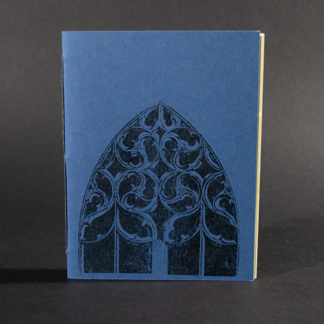 An arched window is on the cover of this blue octavo pamphlet book