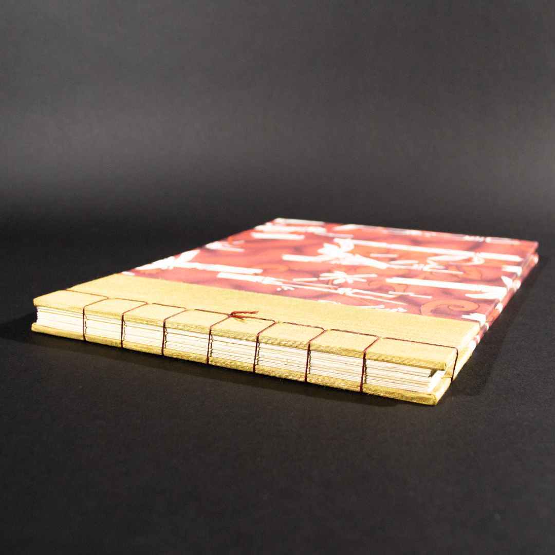 Stab bound Hawaiian photo album spine view showing stiching
