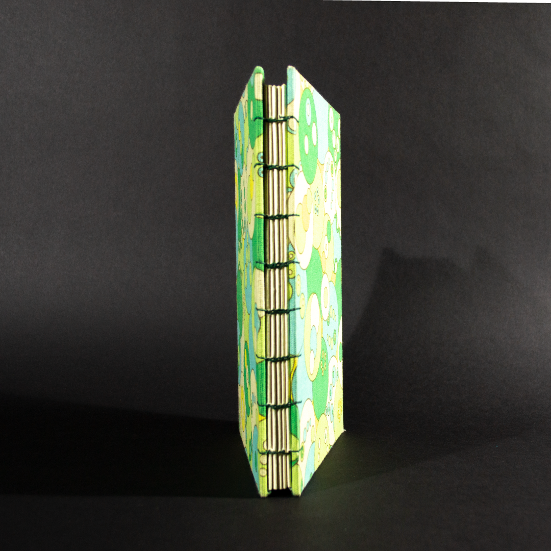 Spine detail of retro circles quarto Coptic bound journal