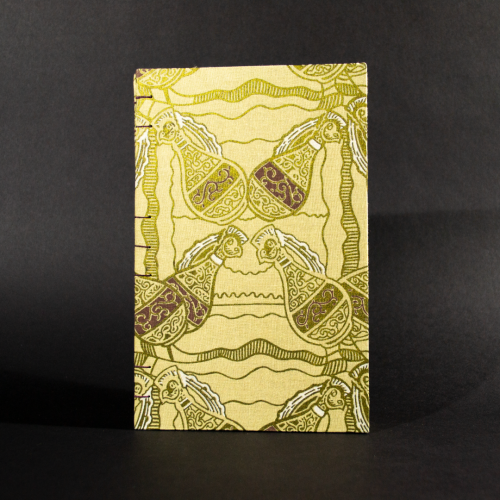 Front cover of four jugs lined quarto Coptic bound journal with gold jugs on an ivory background